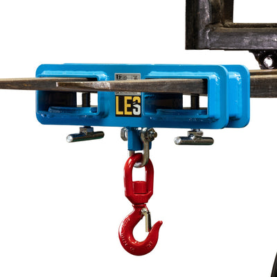 A Forklift accessory that creates a lifting point on the forks to aid in lifting loads and materials.